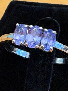 Tanzanite 3-stone violet ring in rhodium plated sterling silver. Size 8